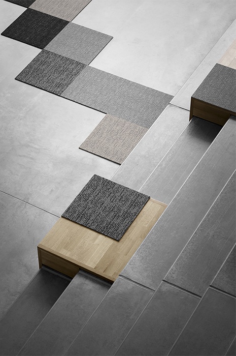 Carpet tiles laid out on a plain floor to show the great flexibility Carpet tiles laid out on a plain floor to show the great flexibility